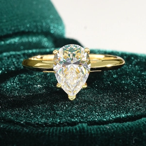 Pear cut moissanite ring with 18K gold plated S925 silver on dark green velvet box