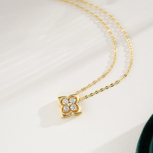 Elegant 14K gold plated sterling silver necklace with four-leaf clover moissanite pendant