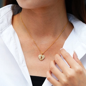14K gold plated 925 sterling silver lightning heart necklace worn by a model