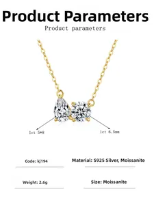 Détail du pendentif en moissanite double avec pierres de taille poire et ronde en or 14K