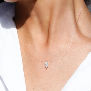 Minimalist S925 silver marquise-cut moissanite pendant on an invisible nylon fishline chain