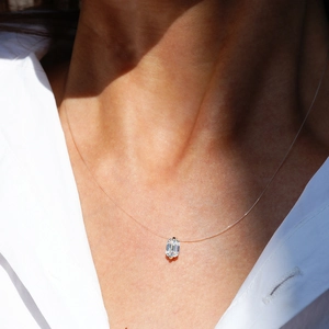 Minimalist S925 silver necklace with emerald cut moissanite on transparent fish line