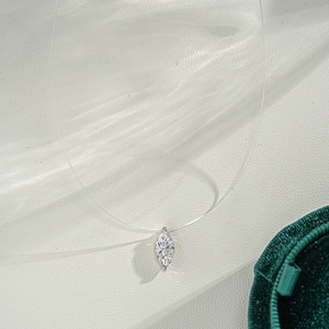 Marquise-cut 1ct moissanite pendant on invisible nylon wire chain over white background