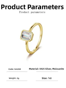 Detail view of 1ct emerald cut moissanite ring with gold plated bezel setting