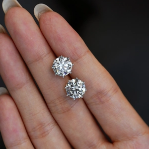Classic 11mm S925 silver six-prong moissanite stud earrings shown in hand for scale