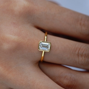 Emerald cut moissanite ring in 18k gold plated S925 silver with a sleek bezel setting