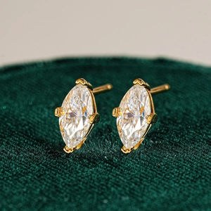 Macro shot of marquise-cut moissanite earrings with gold plated S925 silver four-prong setting