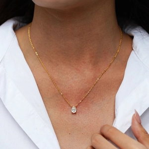 Minimalist 925 sterling silver necklace with a 1 carat pear shaped gold waterdrop pendant