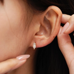 Marquise-cut moissanite stud earring in S925 sterling silver with gold claw setting