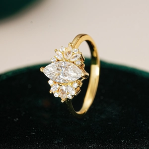 Marquise-cut moissanite ring in S925 silver with elegant gold starburst setting