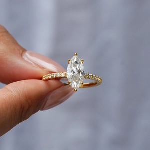 Elegant gold S925 silver marquise-cut moissanite ring with side accent diamonds