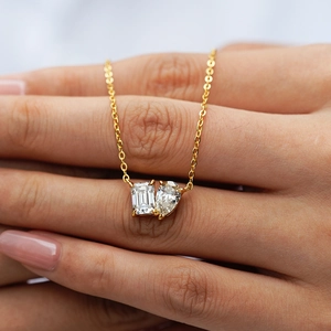 Elegant 18K gold S925 silver necklace featuring emerald and pear cut moissanite pendants