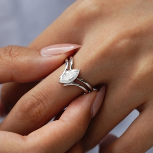 Elegant marquise-cut moissanite ring set in S925 sterling silver with V-shaped wedding band