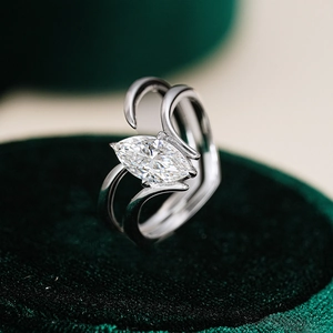 Macro view of marquise-cut moissanite stone on S925 silver double-layered curved ring