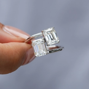 Elegant emerald-cut moissanite silver ring featuring a double stone open-band design