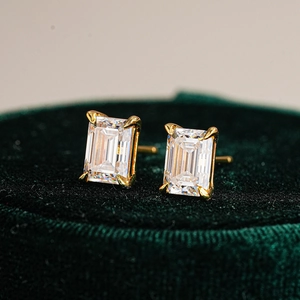 925 silver emerald cut moissanite stud earrings in gold claws on green velvet box