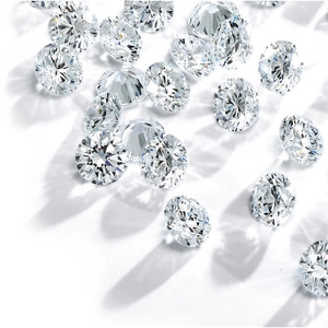 Macro shot of loose round brilliant cut moissanite stones with strong fire on white base