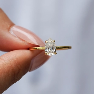 Pear cut moissanite engagement ring in 18k gold plated sterling silver with 4-prong setting