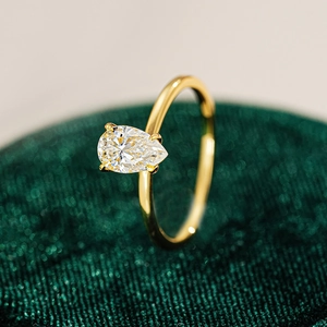 Macro view of pear-cut moissanite solitaire ring in 18K gold plated S925 silver
