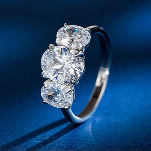 Macro detail of three oval-cut moissanite stones set in an S925 sterling silver ring