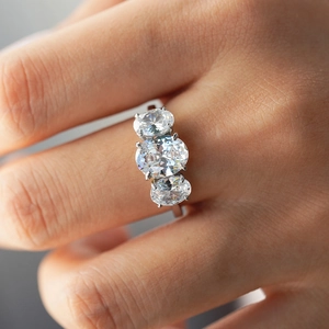 Minimalist S925 silver ring featuring three oval-cut moissanite stones in a four-prong setting