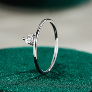 Macro side view of an S925 sterling silver ring with a sparkling moissanite stone