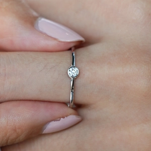Minimalist S925 sterling silver ring with a round bezel-set moissanite stone