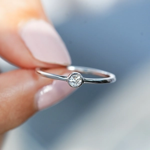 Minimalist S925 sterling silver ring with a bezel-set round moissanite gemstone for women