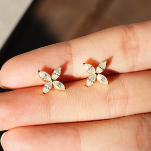 925 silver four-leaf clover stud earrings with marquise-cut moissanite in gold finish
