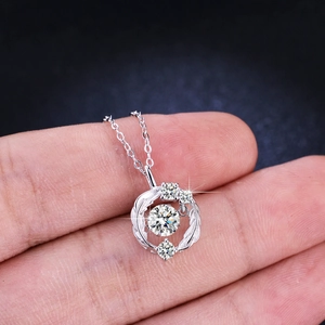 Elegant 925 sterling silver necklace featuring a dancing moissanite pendant with halo
