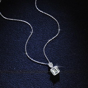 Elegant S925 sterling silver necklace with emerald-cut moissanite pendant on dark leather
