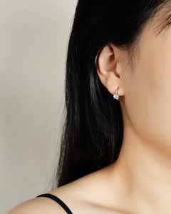 Elegant s925 silver hook earrings featuring a round moissanite solitaire in four-prong setting