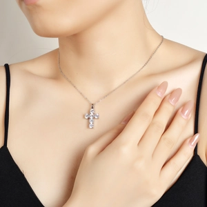 Elegant 925 sterling silver cross pendant necklace with moissanite on female model