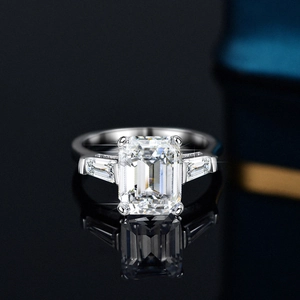 Classic S925 silver ring with a 4ct emerald cut moissanite and tapered baguette side stones