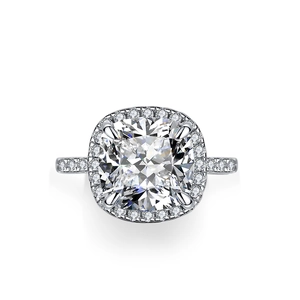 Luxury cushion cut silver ring with halo diamonds and pavé setting in front view