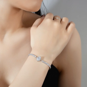 925 silver bracelet featuring pear-shaped moissanite stone on a model's wrist