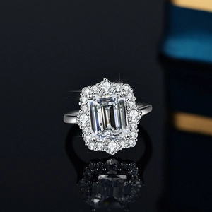 Luxurious S925 silver ring featuring a 4-carat emerald-cut moissanite with a halo setting
