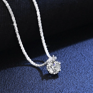 Macro view of S925 sterling silver necklace with sparkling moissanite in six-prong setting