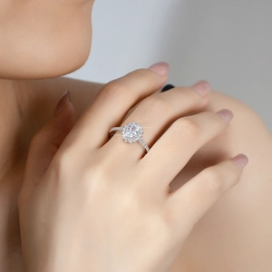 Elegant S925 sterling silver oval halo moissanite ring on a female finger model