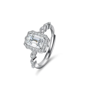 Elegant s925 silver ring featuring emerald cut moissanite and twisted halo design