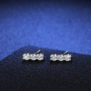 Elegant S925 sterling silver three-stone moissanite stud earrings in silver tone