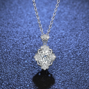 Elegant s925 silver necklace with oval moissanite crown pendant on blue background