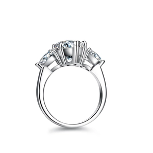 Elegant S925 silver ring featuring 4ct pear-cut moissanite with side stones in six-prong setting