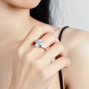 Elegant S925 silver ring featuring 4-carat pear-shaped moissanite on model hand