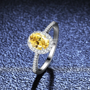Oval yellow moissanite ring in S925 sterling silver with halo setting and side diamonds