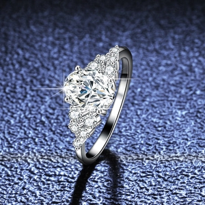 Classic S925 sterling silver ring with 1.5ct oval moissanite and side stones on blue fabric
