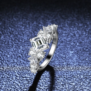 925 silver ring featuring a large princess cut moissanite with side stone accents