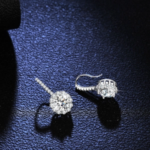 Luxury S925 sterling silver halo moissanite lever-back earrings on blue leather