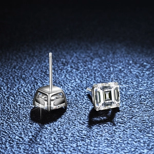 Square emerald cut silver stud earrings with high-clarity stones in a classic four-prong setting