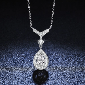 S925 sterling silver necklace featuring a pear-cut moissanite teardrop pendant on cross chain